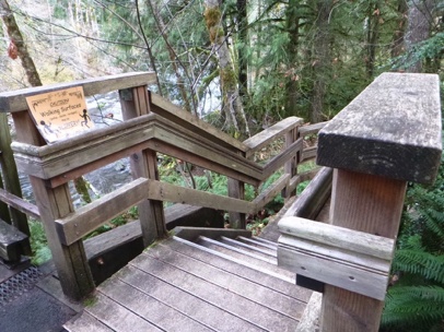Long wooden stairway with railing to Salmon River – east end of the wooden footbridge – slippery when wet